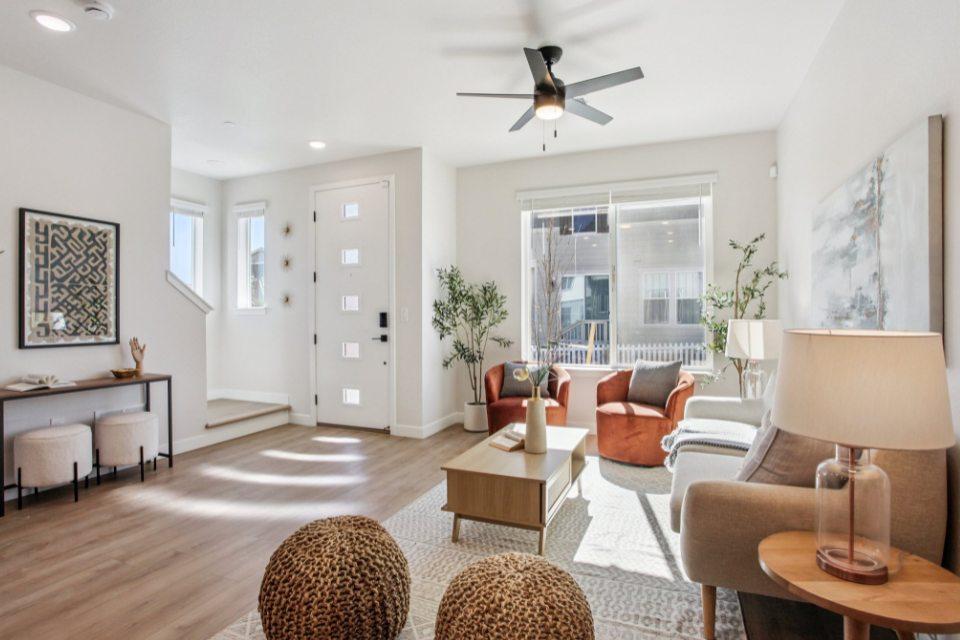 Bright open-concept great room inside a brand-new Alpine Crossing townhome